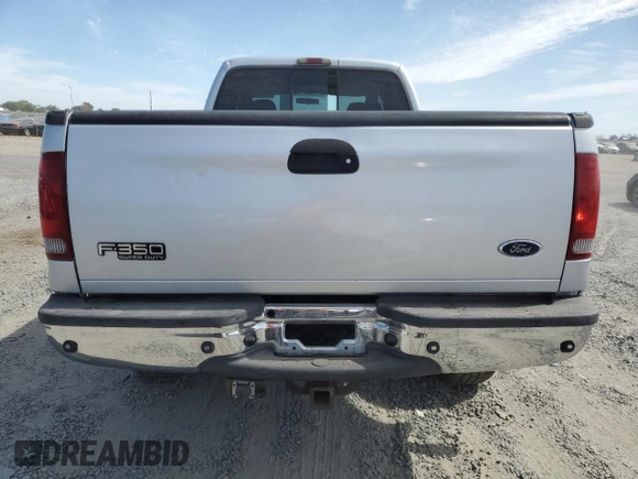 2004 Ford F-350 XL with VIN 1FTSW31P04EC44129, listed as a Copart auction lot 63519165 with 205,411 mi miles and Salvage title. Bid and sale history available at DreamBid. Image 6.