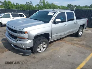 2017 Chevrolet Silverado 1500 LT with VIN 3GCUKREC5HG285689, listed as a IAAI auction lot 42055959 with 128,237 mi miles and . Bid and sale history available at DreamBid. Image 2.