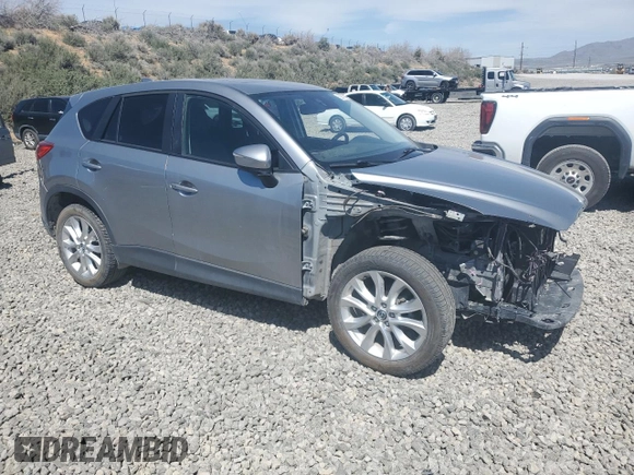 2015 Mazda CX-5 Grand Touring with VIN JM3KE4DY5F0540655, listed as a Copart auction lot 52893155 with 152,279 mi miles and Salvage Title. Bid and sale history available at carsss.com. Image 4.