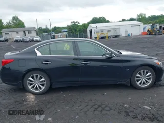 2014 Infiniti Q50 Premium z VIN JN1BV7AR3EM697330, wystawiony jako IAAI lot #42536087 z przebiegiem 231 222 mil mil oraz . Historia ofert i sprzedaży dostępna na DreamBid. Obrazek 13.