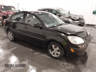 2009 Kia Rio LX with VIN KNADE223X96551856, listed as a IAAI auction lot 41711282 with 81,520 mi miles and . Bid and sale history available at DreamBid. Image 1.