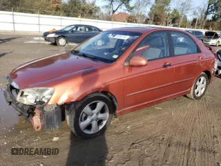 2009 Kia Spectra SX with VIN KNAFE221X95026213, listed as a Copart auction lot 85348104 with 124,171 mi miles and Salvage Title. Bid and sale history available at carsss.com. Image 1.