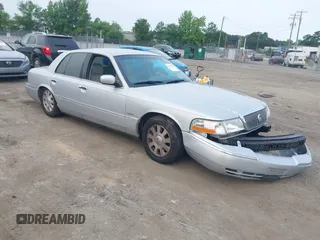 2003 Mercury Grand Marquis LS Premium z VIN 2MEFM75W03X658118, wystawiony jako IAAI lot #42435812 z przebiegiem 174 893 mil mil oraz . Historia ofert i sprzedaży dostępna na DreamBid. Obrazek 1.