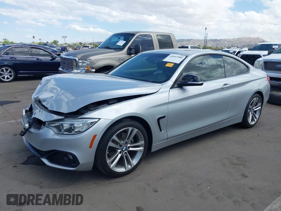 2015 BMW 4 Series 428i with VIN WBA3N7C54FK225045, listed as a IAAI auction lot 42042980 with 72,909 mi miles. Bid and sale history available at carsss.com. Image 2.