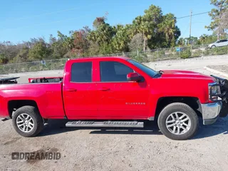 2018 Chevrolet Silverado 1500 LT with VIN 1GCRCREC1JZ170659, listed as a IAAI auction lot 41522588 with 129,412 mi miles and . Bid and sale history available at DreamBid. Image 14.