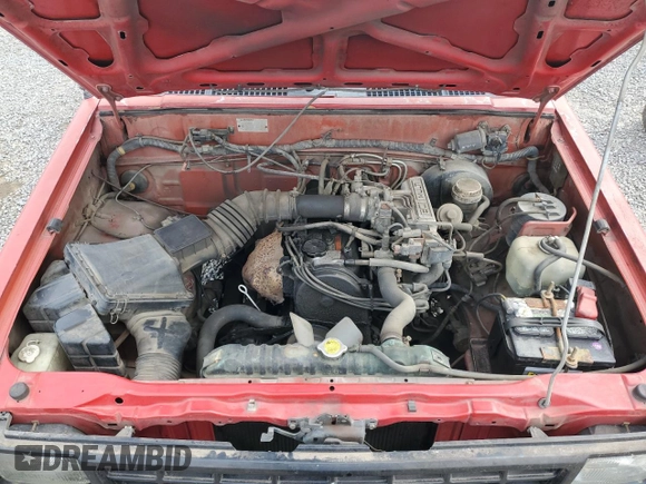 1991 Mitsubishi Mighty Max z VIN JA7FL24W2MP026041, wystawiony jako Copart lot #79159244 z przebiegiem 219 903 mil mil oraz Szkoda całkowita • Salvage title. Historia ofert i sprzedaży dostępna na DreamBid. Obrazek 11.