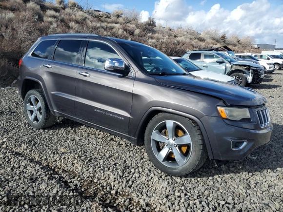2015 Jeep Grand Cherokee Overland with VIN 1C4RJFCT4FC118184, listed as a Copart auction lot 44465045 with 143,149 mi miles and Salvage Title. Bid and sale history available at carsss.com. Image 4.