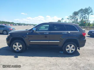 2011 Jeep Grand Cherokee Overland with VIN 1J4RR6GT1BC647292, listed as a IAAI auction lot 42069742 with 199,340 mi miles. Bid and sale history available at carsss.com. Image 14.