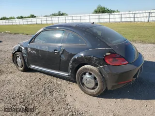 2012 Volkswagen Beetle 2.5L PZEV with VIN 3VWJP7ATXCM627644, listed as a Copart auction lot 73436334 with 97,039 mi miles and Salvage Title. Bid and sale history available at carsss.com. Image 2.