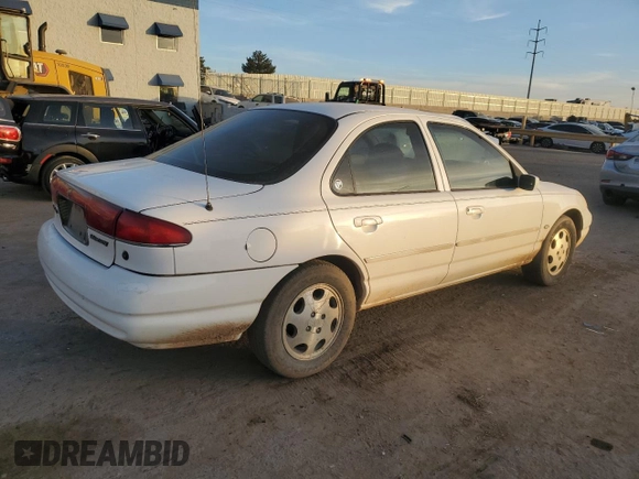 1999 Mercury Mystique GS z VIN 1MEFM6532XK638087, wystawiony jako Copart lot #85269414 z przebiegiem 192 506 mil mil oraz Szkody całkowita. Historia ofert i sprzedaży dostępna na DreamBid. Obrazek 3.