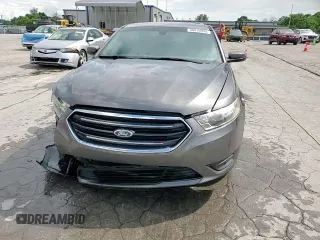 2014 Ford Taurus SEL z VIN 1FAHP2E80EG174910, wystawiony jako Copart lot #56070945 z przebiegiem 147 201 mil mil oraz Szkody całkowita. Historia ofert i sprzedaży dostępna na DreamBid. Obrazek 13.
