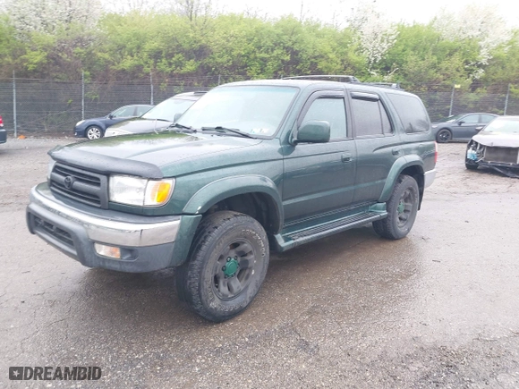 2000 Toyota 4Runner SR5 with VIN JT3HN86R9Y0294975, listed as a IAAI auction lot 41985007 with 218,761 mi miles. Bid and sale history available at carsss.com. Image 2.