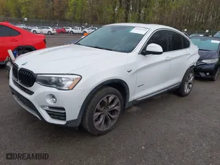 2018 BMW X4 xDrive28i with VIN 5UXXW3C57J0T82081, listed as a IAAI auction lot 41991254 with 100,654 mi miles. Bid and sale history available at carsss.com. Image 2.