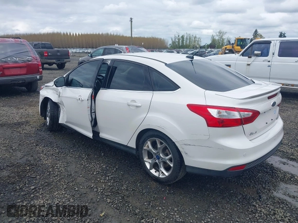 2014 Ford Focus Titanium with VIN 1FADP3J27EL142095, listed as a IAAI auction lot 42004419 with 139,515 mi miles. Bid and sale history available at carsss.com. Image 3.