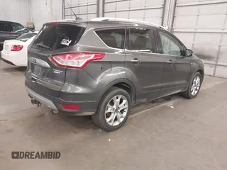 2015 Ford Escape Titanium with VIN 1FMCU9J96FUA43337, listed as a IAAI auction lot 41825328 with 149,639 mi miles and . Bid and sale history available at DreamBid. Image 4.