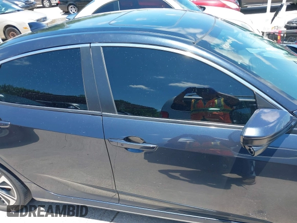 2017 Honda Civic EX-L with VIN 2HGFC1F73HH650011, listed as a IAAI auction lot 42459621 with 142,130 mi miles and . Bid and sale history available at DreamBid. Image 13.