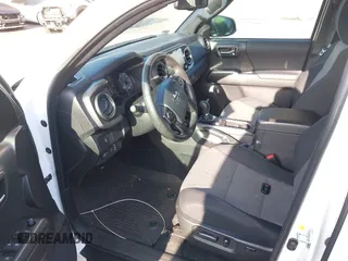 2023 Toyota Tacoma SR5 z VIN 3TMAZ5CNXPM208862, wystawiony jako IAAI lot #42206860 z przebiegiem 11 354 mil mil oraz . Historia ofert i sprzedaży dostępna na DreamBid. Obrazek 20.