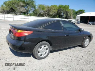 2001 Saturn SC with VIN 1G8ZR12701Z223174, listed as a Copart auction lot 52033445 with 234,079 mi miles and Salvage Title. Bid and sale history available at carsss.com. Image 3.