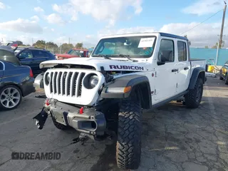 2023 Jeep Gladiator Rubicon z VIN 1C6JJTBG5PL566958, wystawiony jako IAAI lot #42298811 z przebiegiem 18 568 mil mil oraz . Historia ofert i sprzedaży dostępna na DreamBid. Obrazek 2.