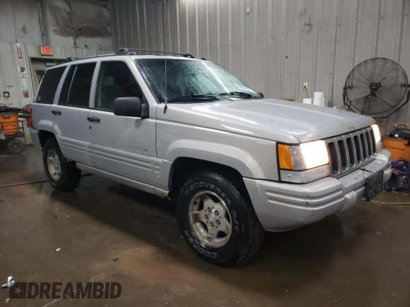 1998 Jeep Grand Cherokee Laredo with VIN 1J4GZ48S3WC269693, listed as a Copart auction lot 85026074 with 308,791 mi miles and Salvage Title. Bid and sale history available at carsss.com. Image 4.