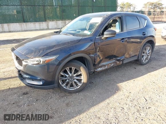2020 Mazda CX-5 Grand Touring with VIN JM3KFBDM4L0779284, listed as a IAAI auction lot 42060936 with 9,227 mi miles. Bid and sale history available at carsss.com. Image 18.