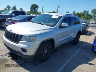 2011 Jeep Grand Cherokee Laredo with VIN 1J4RS4GGXBC513523, listed as a IAAI auction lot 42203802 with 242,239 mi miles and . Bid and sale history available at DreamBid. Image 2.