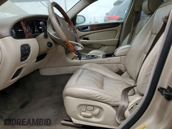 2004 Jaguar XJ with VIN SAJEA74C84SG03857, listed as a Copart auction lot 62156875 with 92,649 mi miles and Salvage title. Bid and sale history available at DreamBid. Image 7.