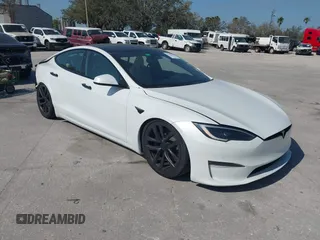 2022 Tesla Model S Plaid with VIN 5YJSA1E64NF484904, listed as a IAAI auction lot 41594464 with 25,299 mi miles and . Bid and sale history available at carsss.com. Image 1.