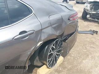 2023 Toyota Camry LE z VIN 4T1C11AK8PU132325, wystawiony jako IAAI lot #42093856 z przebiegiem 29 115 mil mil oraz . Historia ofert i sprzedaży dostępna na DreamBid. Obrazek 6.