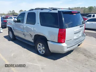 2014 GMC Yukon SLT with VIN 1GKS1CE04ER121301, listed as a IAAI auction lot 41825056 with 141,562 mi miles. Bid and sale history available at carsss.com. Image 3.