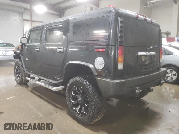 2003 Hummer H2 with VIN 5GRGN23U33H143023, listed as a Copart auction lot 84403414 with 0 mi miles and Salvage Title. Bid and sale history available at carsss.com. Image 2.