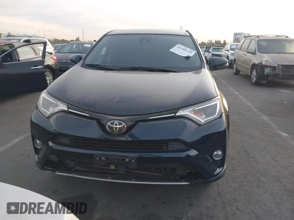 2018 Toyota RAV4 XLE with VIN JTMWFREV2JJ151595, listed as a IAAI auction lot 41380691 with 79,515 mi miles and . Bid and sale history available at carsss.com. Image 12.