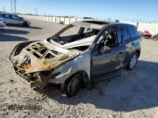 2015 Mazda CX-5 Touring with VIN JM3KE4CYXF0515106, listed as a Copart auction lot 50451185 with 0 mi miles and Salvage Title. Bid and sale history available at carsss.com. Image 1.