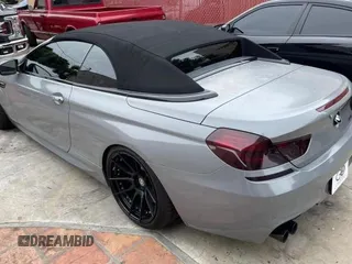 2016 BMW M6 z VIN WBS6G9C54GD932196, wystawiony jako Copart lot #53960063 z przebiegiem 46 162 mil mil oraz . Historia ofert i sprzedaży dostępna na DreamBid. Obrazek 3.