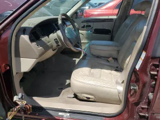 2000 Lincoln Town Car Signature with VIN 1LNHM82W2YY809189, listed as a Copart auction lot 59812665 with 148,236 mi miles and Salvage title. Bid and sale history available at DreamBid. Image 7.