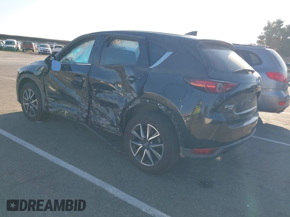 2018 Mazda CX-5 Grand Touring with VIN JM3KFBDM1J0345014, listed as a IAAI auction lot 42703926 with 151,453 mi miles and . Bid and sale history available at DreamBid. Image 3.