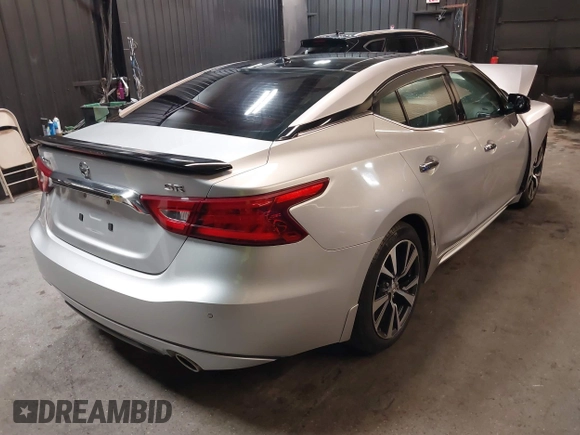 2016 Nissan Maxima SV z VIN 1N4AA6AP4GC415952, wystawiony jako IAAI lot #41806306 z przebiegiem 131 612 mil mil oraz . Historia ofert i sprzedaży dostępna na DreamBid. Obrazek 4.
