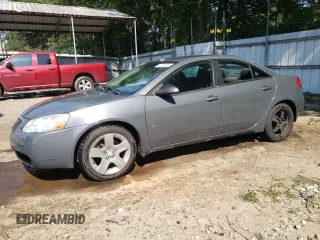 2009 Pontiac G6 1SA with VIN 1G2ZG57B194215064, listed as a Copart auction lot 61823565 with 220,964 mi miles and Salvage title. Bid and sale history available at DreamBid. Image 1.
