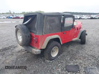 1997 Jeep Wrangler Sport z VIN 1J4FY19S2VP426553, wystawiony jako IAAI lot #41917764 z przebiegiem 154 140 mil mil oraz . Historia ofert i sprzedaży dostępna na DreamBid. Obrazek 4.