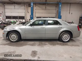 2005 Chrysler 300 with VIN 2C3JA43R55H569369, listed as a IAAI auction lot 41132751 with 123,253 mi miles. Bid and sale history available at carsss.com. Image 12.