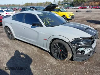 2022 Dodge Charger Scat Pack Widebody with VIN 2C3CDXGJ6NH176650, listed as a IAAI auction lot 41863122 with 34,569 mi miles and . Bid and sale history available at DreamBid. Image 1.
