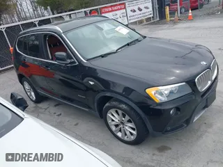 2011 BMW X3 28i with VIN 5UXWX5C59BL701386, listed as a IAAI auction lot 41897310 with 129,863 mi miles. Bid and sale history available at carsss.com. Image 1.