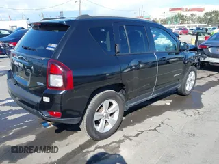 2016 Jeep Compass Latitude with VIN 1C4NJCEB2GD628384, listed as a IAAI auction lot 41752694 with 122,589 mi miles. Bid and sale history available at carsss.com. Image 4.