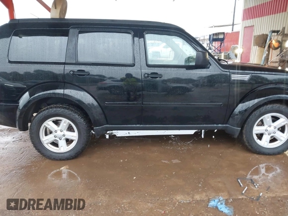 2007 Dodge Nitro SXT with VIN 1D8GT28K67W683600, listed as a IAAI auction lot 40958011 with 70,141 mi miles. Bid and sale history available at carsss.com. Image 13.
