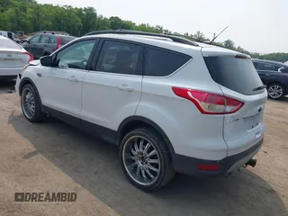 2014 Ford Escape SE with VIN 1FMCU9G99EUC81141, listed as a IAAI auction lot 42436279 with 123,947 mi miles and . Bid and sale history available at DreamBid. Image 3.