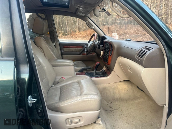 2000 Lexus LX 470 z VIN JT6HT00W5Y0105585, wystawiony jako Copart lot #49099395 z przebiegiem 153 695 mil mil oraz Czysty tytuł • Clean title. Historia ofert i sprzedaży dostępna na DreamBid. Obrazek 5.