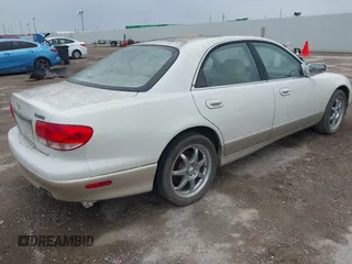 2001 Mazda Millenia S z VIN JM1TA222811710618, wystawiony jako IAAI lot #42292915 z przebiegiem 69 444 mil mil oraz . Historia ofert i sprzedaży dostępna na DreamBid. Obrazek 4.