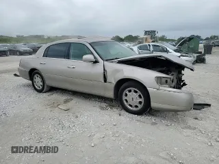 2000 Lincoln Town Car Signature с VIN 1LNHM82W1YY903645, выставлен на аукционе Copart как лот 55663175 с пробегом Не указан миль и Списание • Salvage title. История ставок и продаж доступна на DreamBid. Изображение 13.