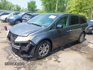 2012 Honda Odyssey EX-L with VIN 5FNRL5H67CB041252, listed as a IAAI auction lot 42158494 with 152,940 mi miles and . Bid and sale history available at DreamBid. Image 18.