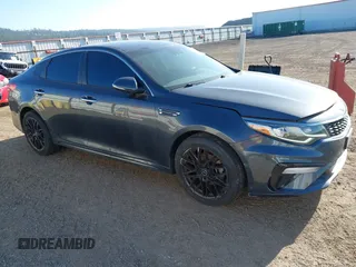 2020 Kia Optima LX z VIN 5XXGT4L3XLG392216, wystawiony jako IAAI lot #42047176 z przebiegiem 86 965 mil mil oraz . Historia ofert i sprzedaży dostępna na DreamBid. Obrazek 1.